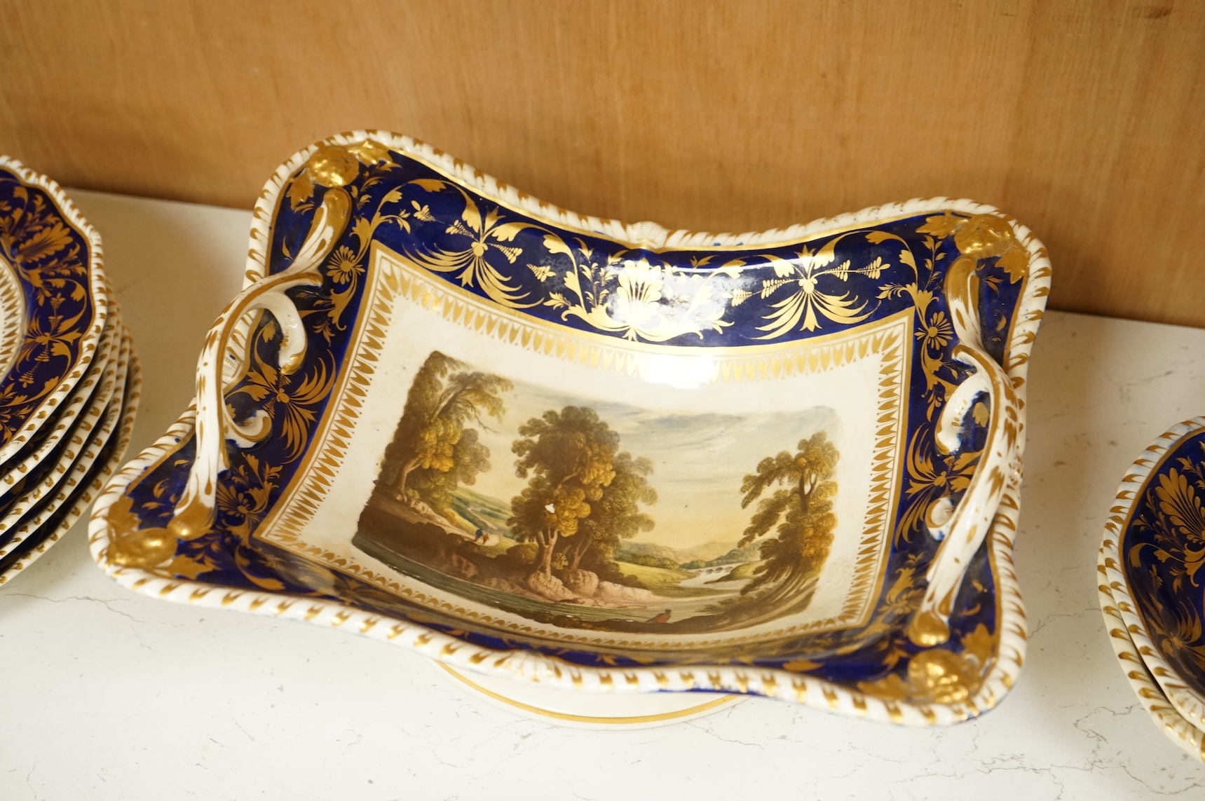 A Bloor Derby titled view part dessert service, c.1820 to include View on the Wye and View in Yorkshire, largest 29cm wide (16)
